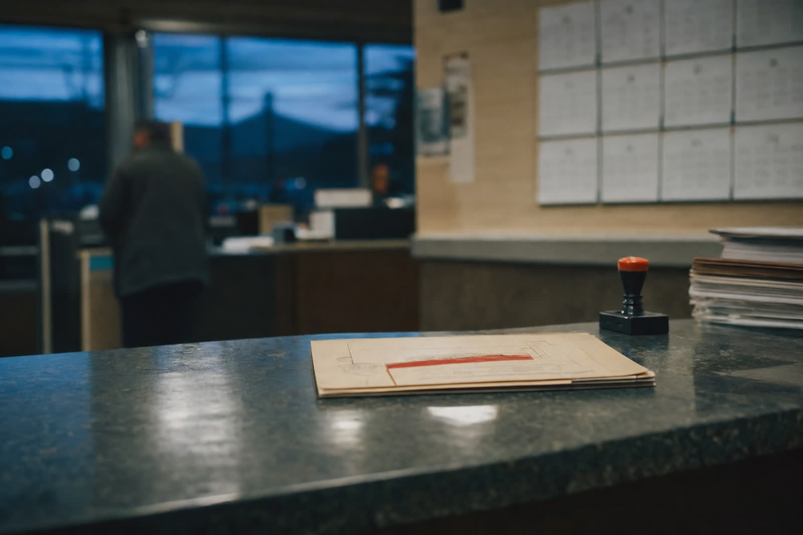 Illustrative scene, not a product screenshot: a county clerk counter with a stamped court filing and a wall calendar